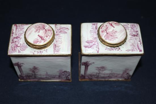 A pair of South Staffordshire enamel tea caddies and covers, and two similar candlesticks, late 18th century, 6.25in. and 10in., candle